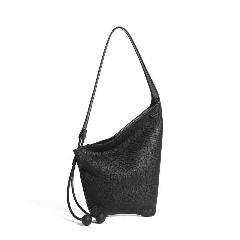 Black leather shoulder bag with drawstring closure and minimalist design on white background
