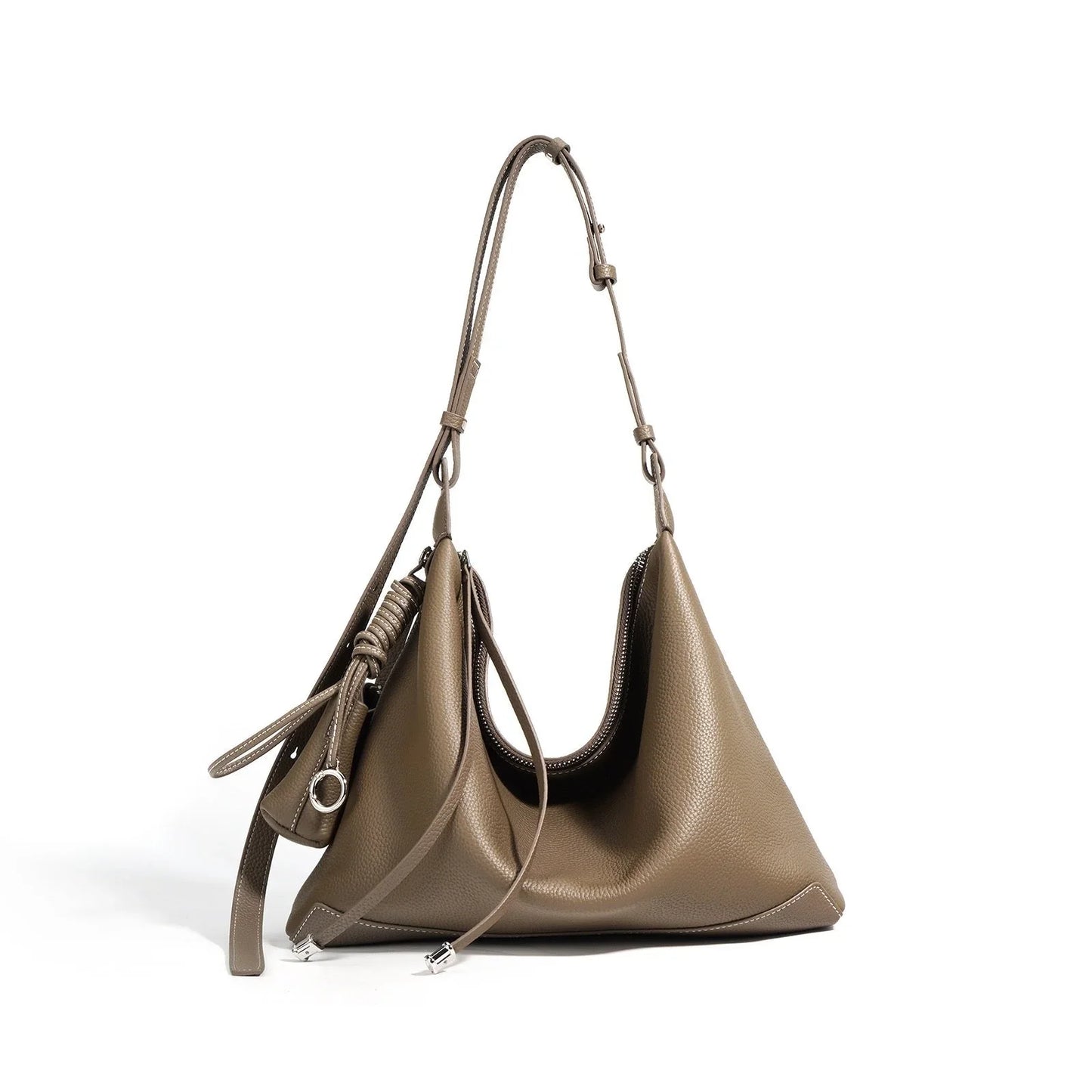 Taupe leather hobo bag with adjustable strap and zipper, fashion accessory on white background