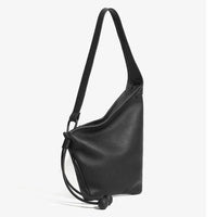 Black leather shoulder bag with drawstring closure and minimalist design on white background