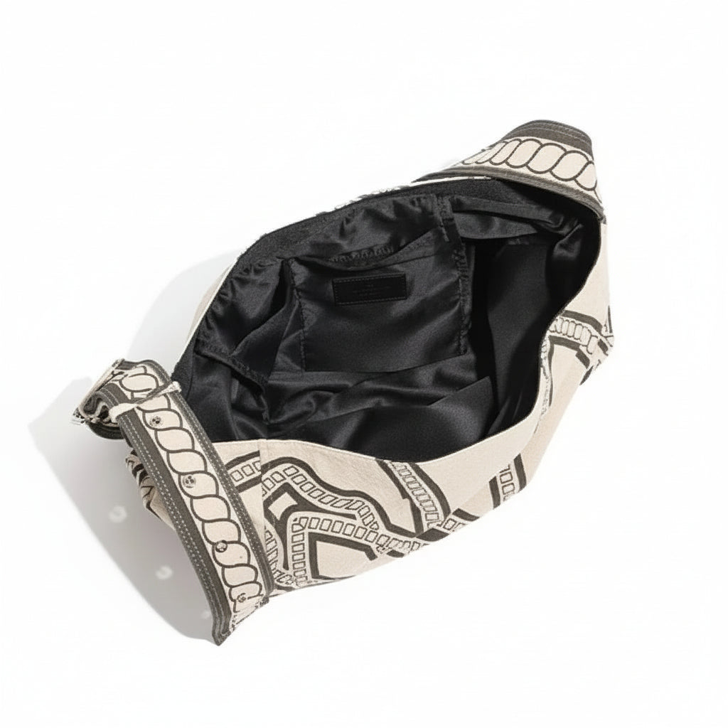 Open canvas shoulder bag with black geometric pattern and spacious black interior pocket