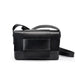 Sleek black leather crossbody bag with wide strap, minimalist design, on white background