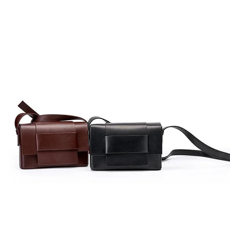 Brown and black leather crossbody handbags with flap design on white background