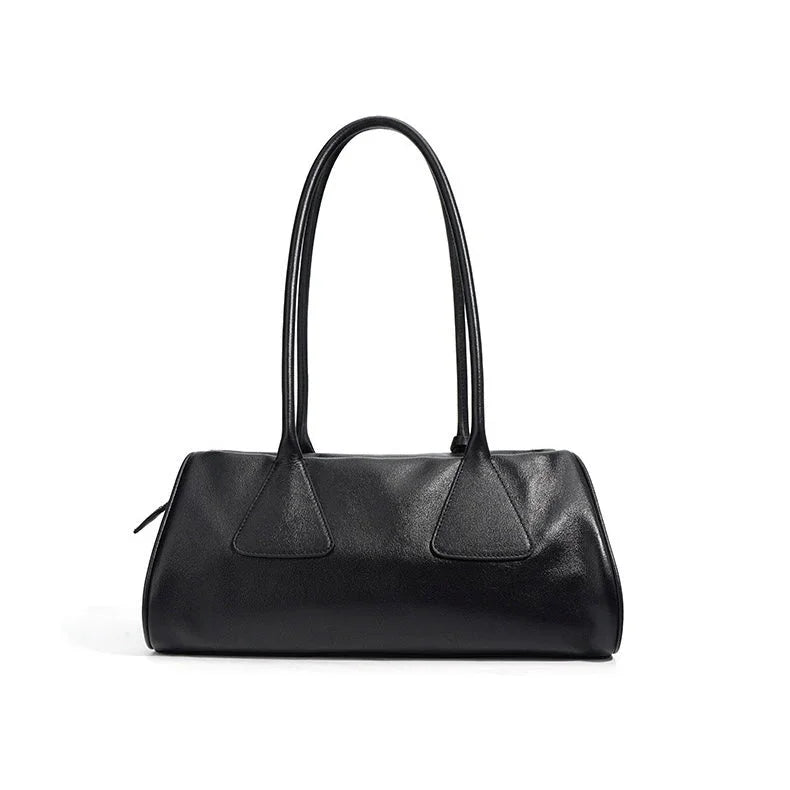 Black leather shoulder bag with double handles on white background
