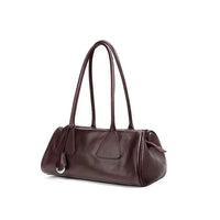 Dark brown leather shoulder bag with double handles on white background