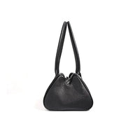 Black leather handbag with double handles and modern triangular shape on white background.