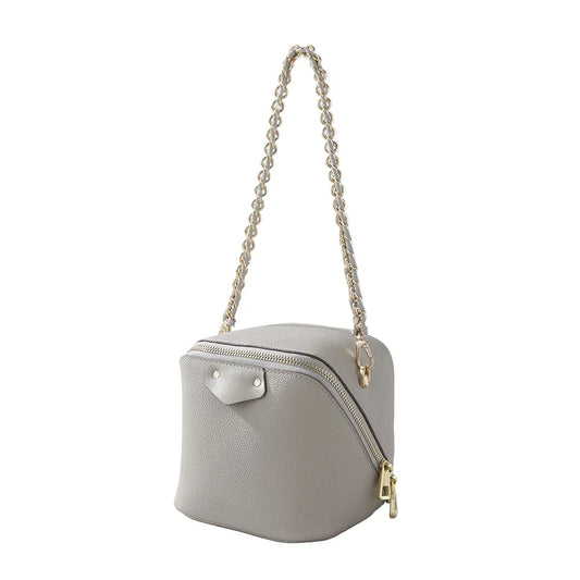 Gray leather cube handbag with gold zipper and chain strap on white background