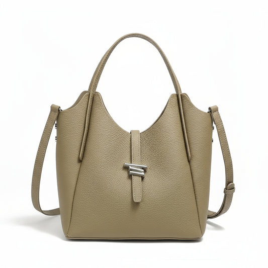 Taupe leather tote handbag with top handle, shoulder strap, and silver clasp on white background