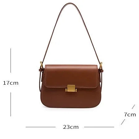 Brown leather shoulder bag with gold clasp, dimensions 23x17x7 cm, white background