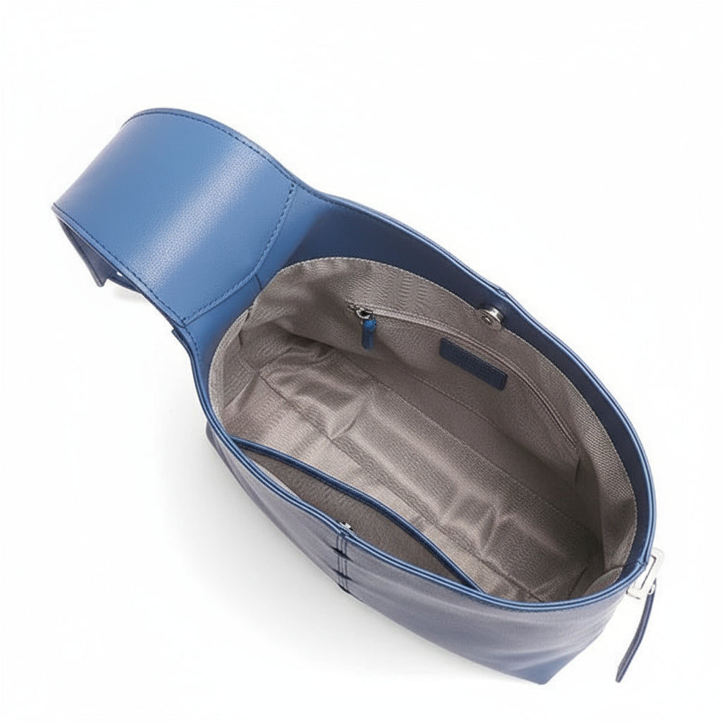 Blue leather crossbody bag with spacious interior and inner zip pocket