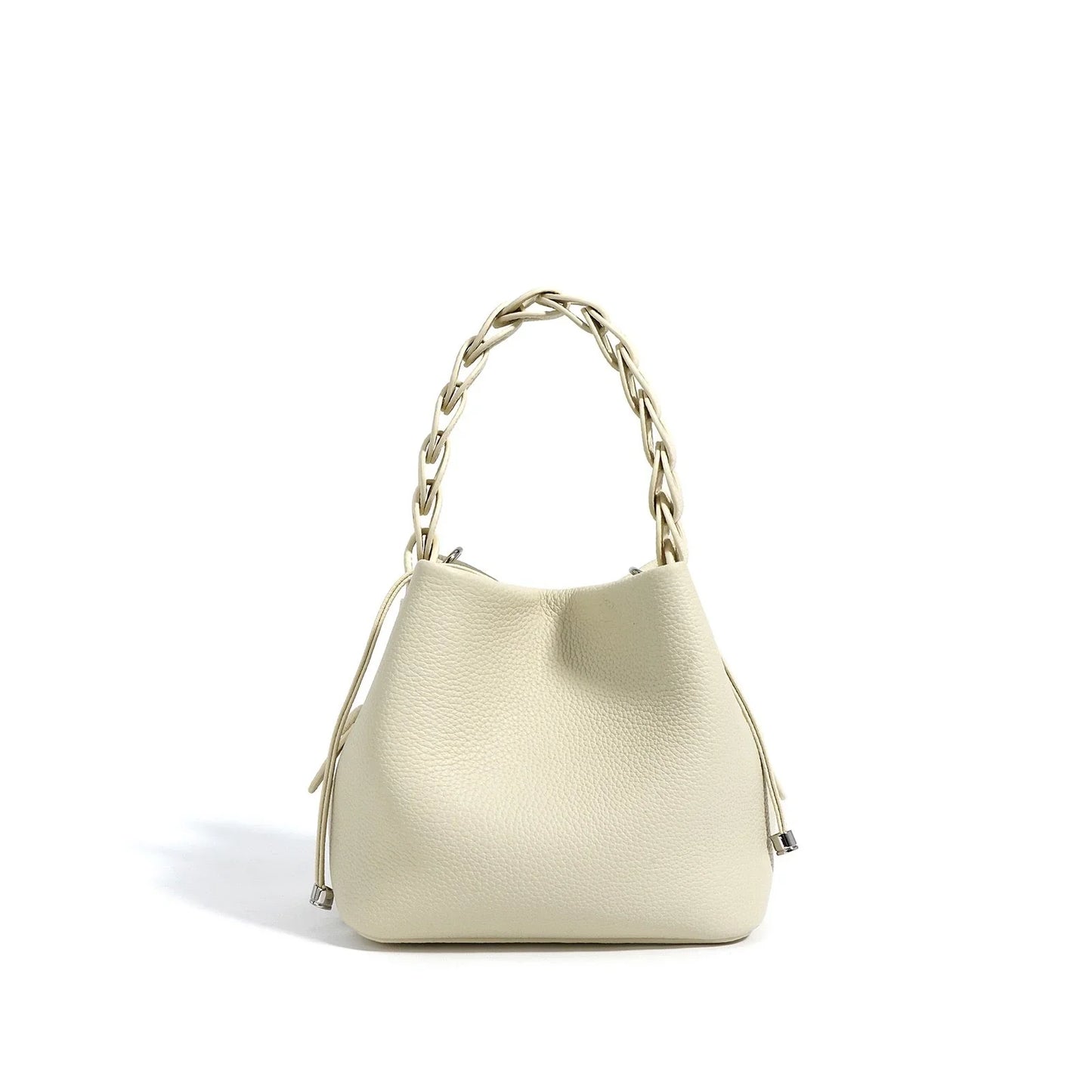 Cream leather bucket bag with braided handle and silver accents on a white background