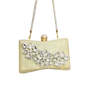 Gold clutch handbag with crystal rhinestone embellishments and a chain strap