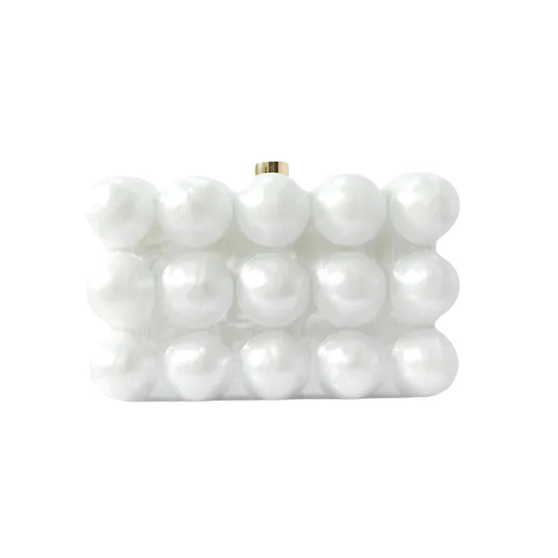 White pearl beaded clutch bag with rectangular shape on white background