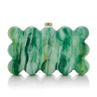 Green acrylic scalloped clutch purse with marble pattern on a white background.