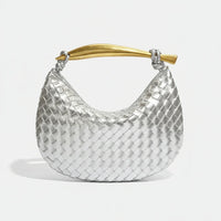 Silver woven hobo bag with gold curved handle on white background