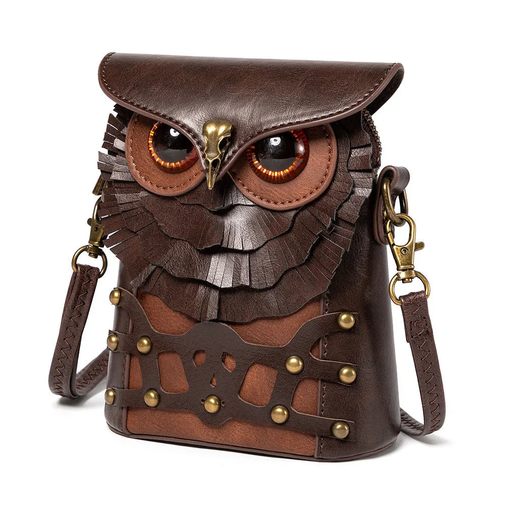 Brown leather crossbody bag shaped like an owl with embossed details and brass hardware.
