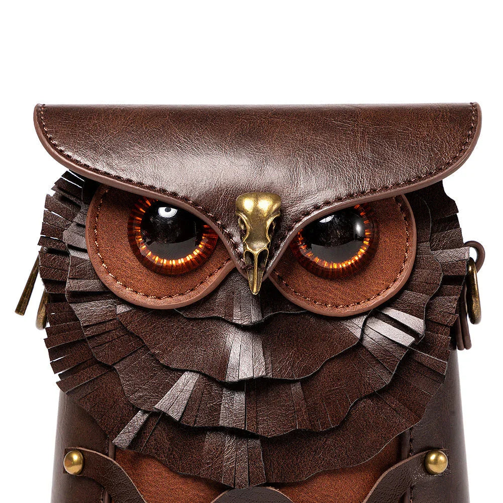 Brown leather owl-shaped shoulder bag with layered feather details and brass accents