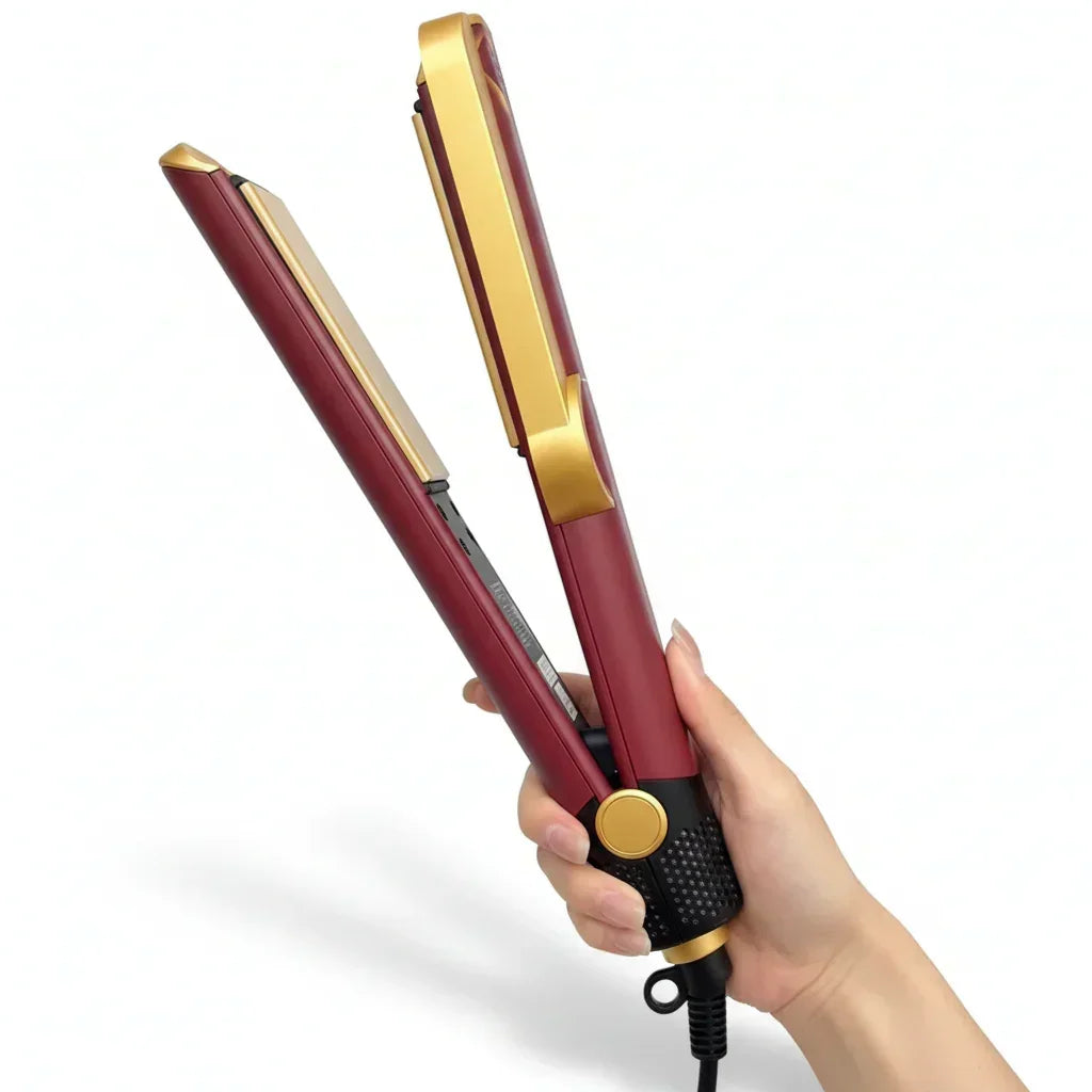 Red and gold hair straightener held by a hand on a white background