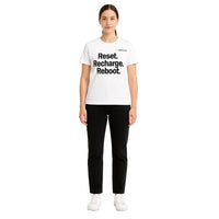 Person wearing a white t-shirt with text on a white background