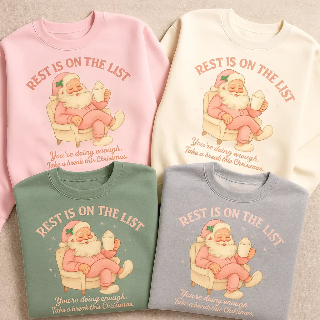 Four Christmas-themed sweatshirts with Santa Claus graphics and text on a neutral background.