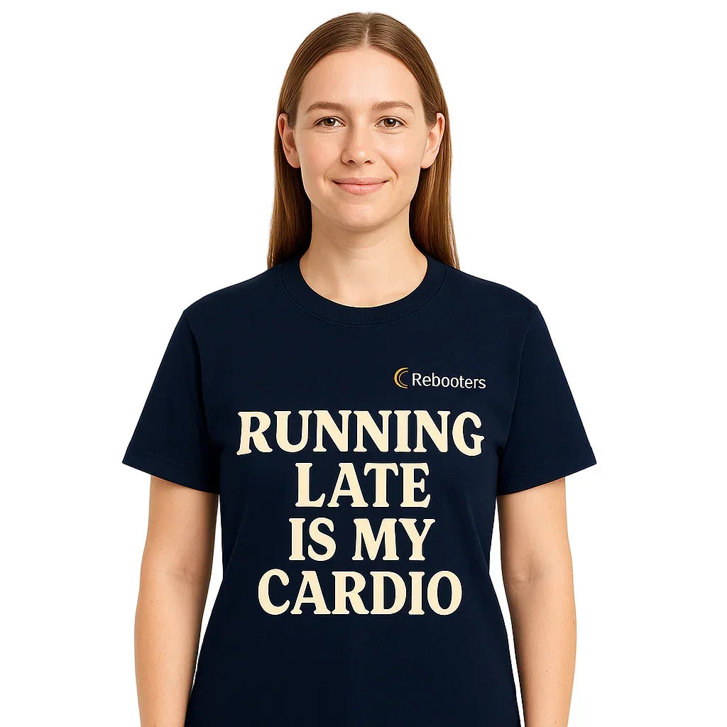Person wearing a navy blue t-shirt with 'Running late is my cardio' text and Rebooters logo.