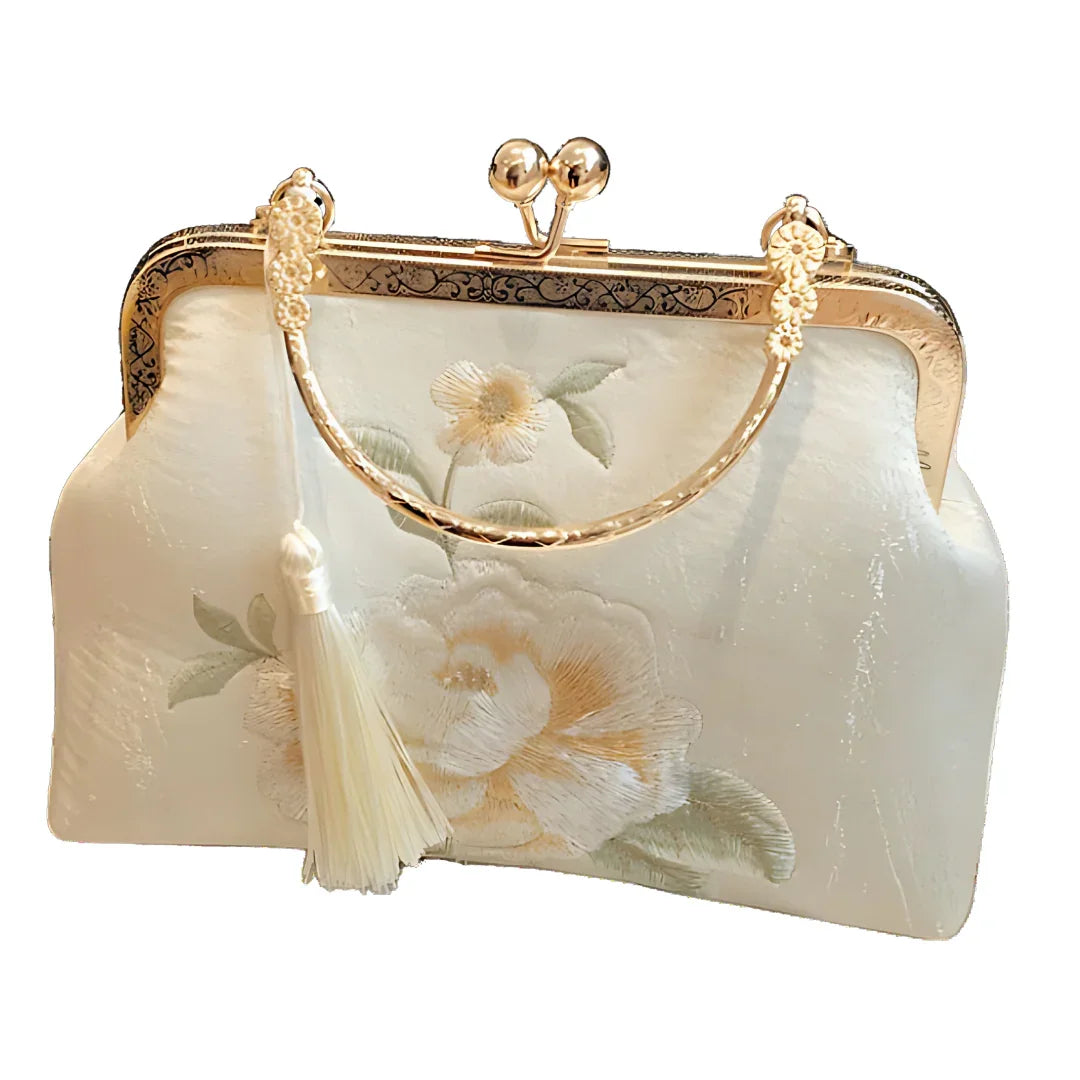 Elegant cream floral embroidered clutch purse with gold handle and tassel