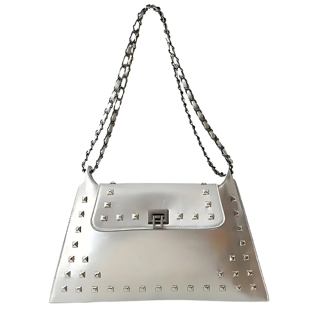 Metallic silver studded handbag with chain strap on white background