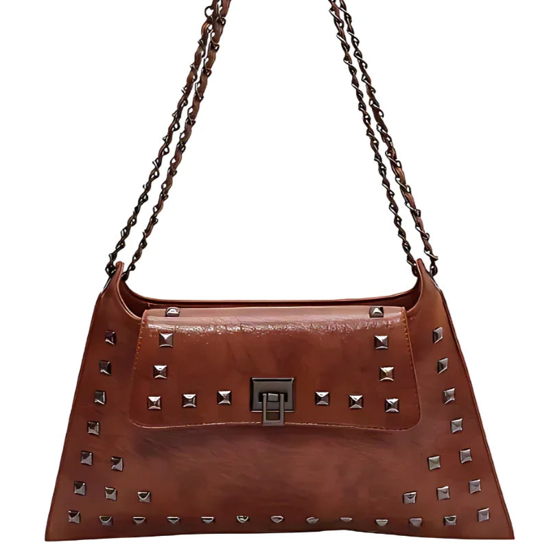 Brown leather shoulder bag with metal studs and double chain strap on white background