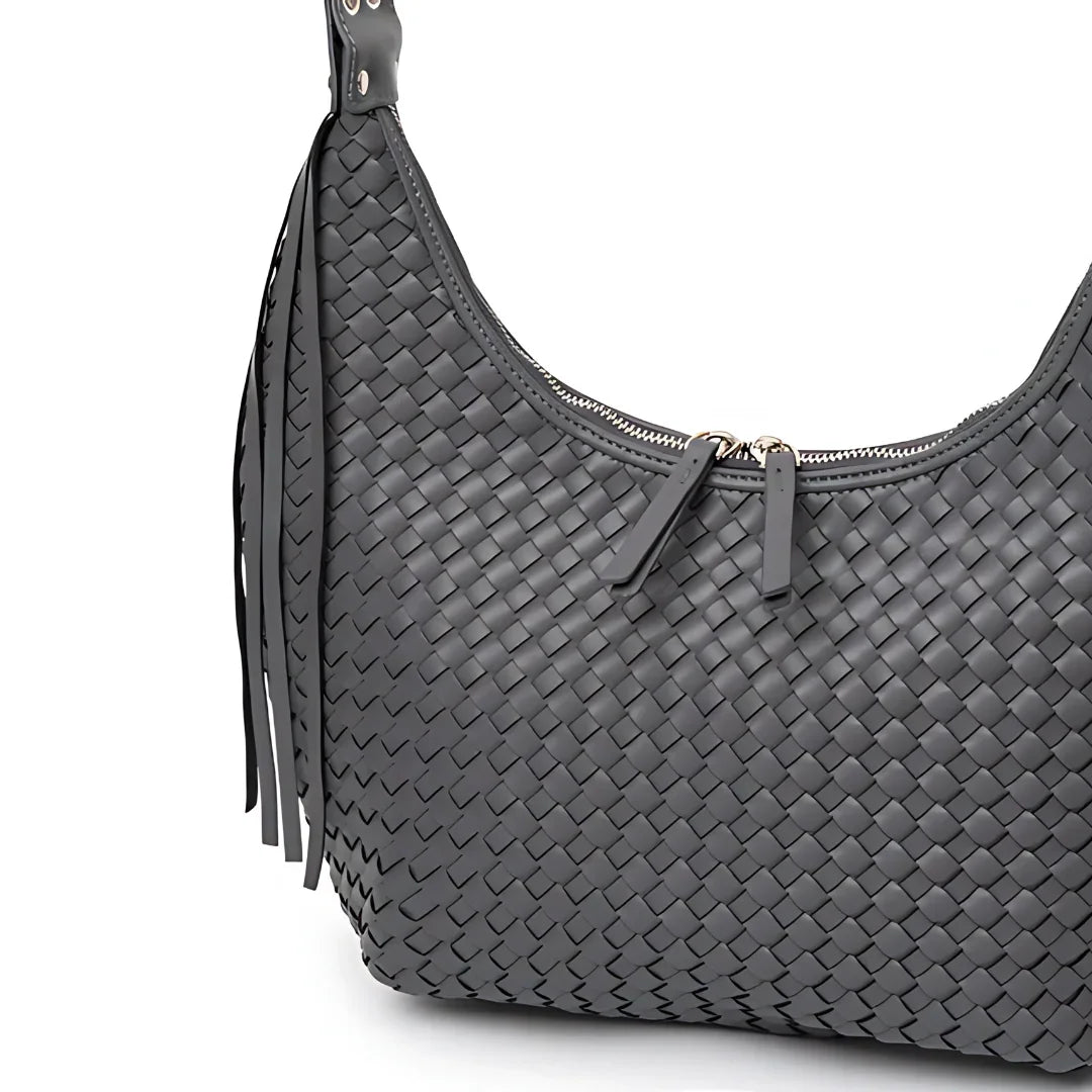 Gray woven leather shoulder bag with zipper closure and fringe detail