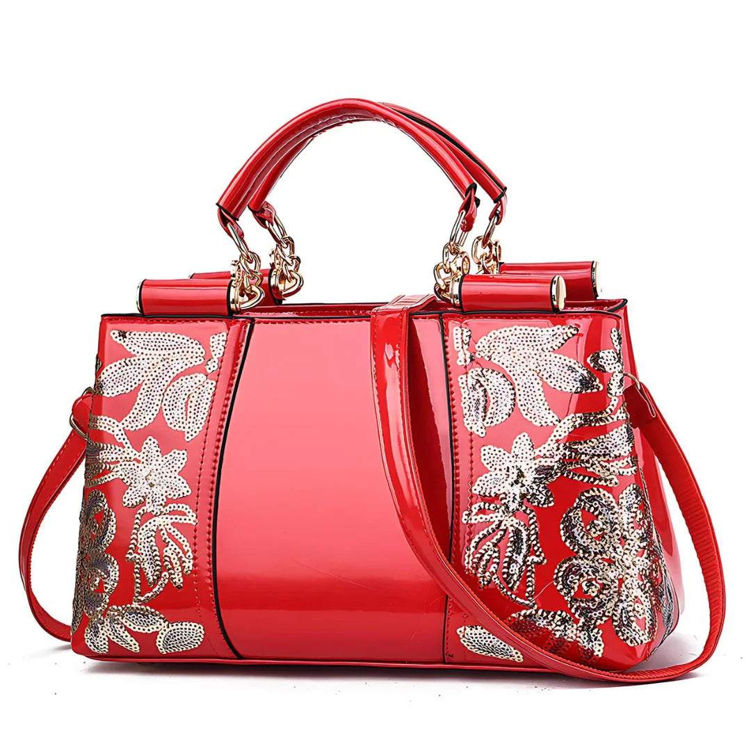 Shiny red handbag with gold floral sequin embroidery and dual handles