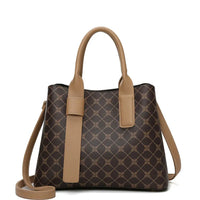 Brown geometric patterned handbag with tan leather handles and shoulder strap