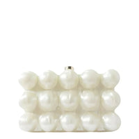 White pearl beaded clutch handbag with geometric design on a plain background