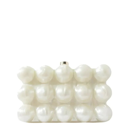 White pearl beaded clutch handbag with geometric design on a plain background