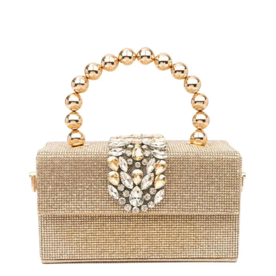 Gold beaded clutch purse with jeweled clasp and round metallic handle on white background