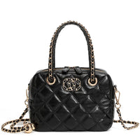 Black quilted leather handbag with gold chain handles and logo, luxury fashion accessory