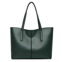 Dark green leather tote bag with double handles on white background