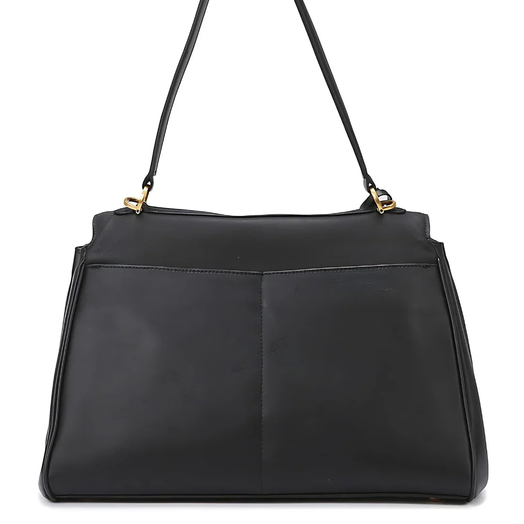 Black leather shoulder bag with gold hardware, front pocket and minimalist design