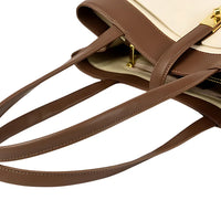 Brown leather designer tote bag with gold clasp and beige accents, close-up view