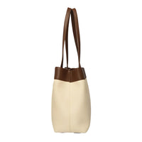 Side view of a beige and brown leather tote bag with double handles