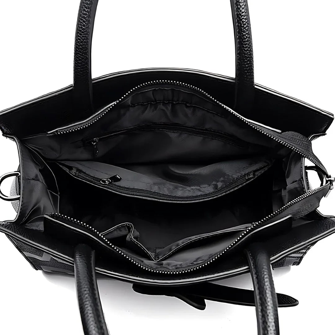 Black leather tote bag interior with zipper pockets and organized compartments