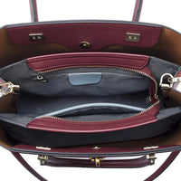 Open burgundy leather handbag with organized interior pockets and gold hardware
