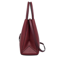 Side view of a maroon leather tote bag with dual handles and crossbody strap