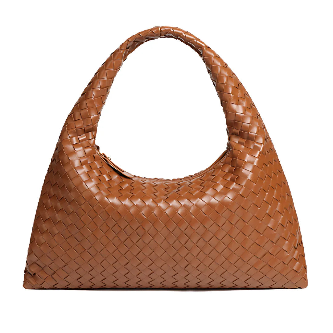 Brown woven leather hobo bag with curved handle on a white background