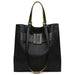 Black textured leather tote bag with wide buckle detail and yellow-lined handles