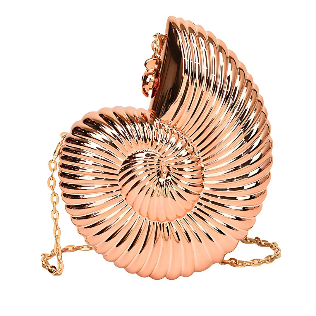 Metallic gold seashell clutch purse with a shiny surface and chain strap