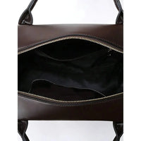 Open brown leather handbag with zipper, showing spacious black interior and handles