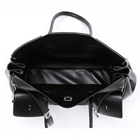 Open black leather tote bag with spacious interior and silver buckle detail