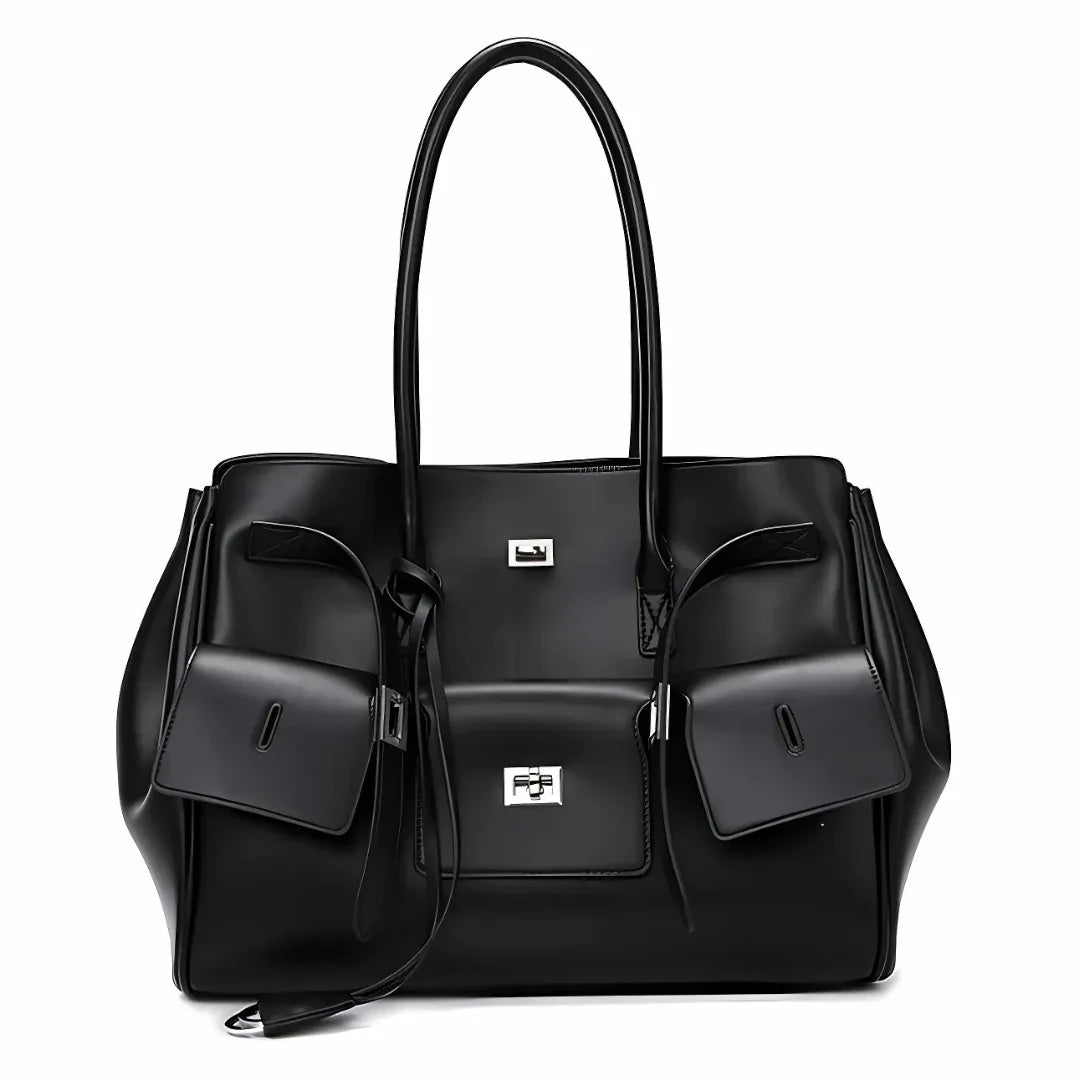 Black leather tote bag with silver hardware, front pockets, and double handles