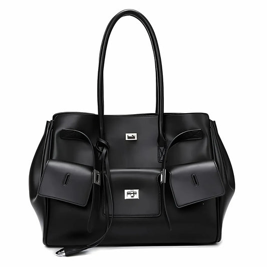 Black leather tote bag with silver hardware, front pockets, and double handles
