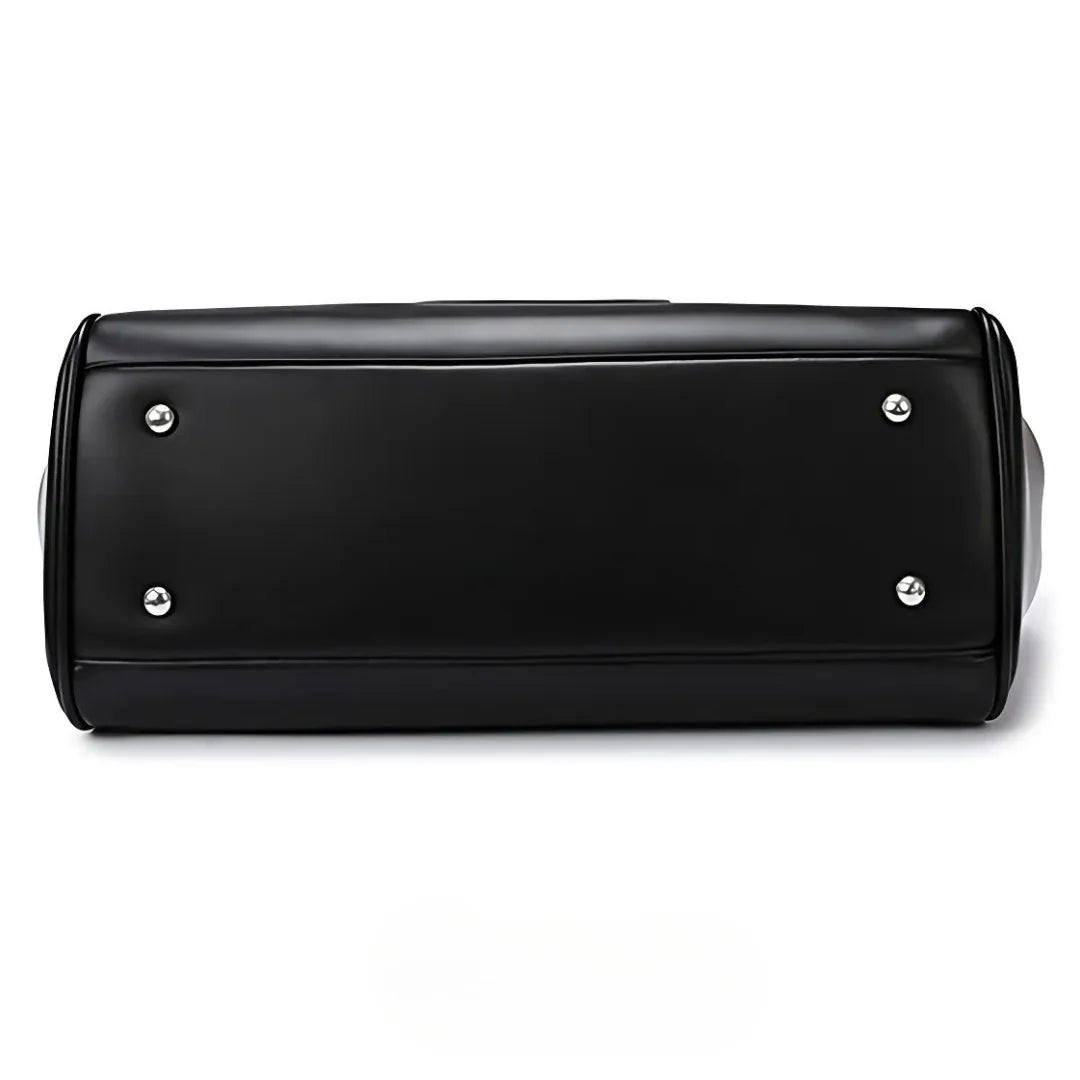 Black faux leather bag bottom with metal feet, clean minimalist design