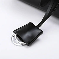 Black leather bag with silver metal ring keychain detail on white background
